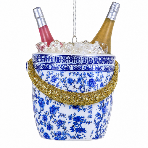 Glass chinoiserie champagne bucket ornament with blue-and-white floral pattern.
Holiday ornament showing two bottles in an ice bucket with glittered gold handles.
4.5 inch glass party décor ornament with silver hanging cord.