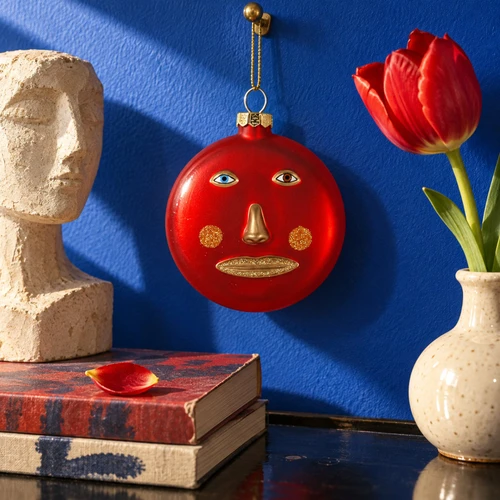 Cody Foster Le Visage Red Disc Glass Ornament – glass Christmas ornament styled in a fun, eclectic home scene