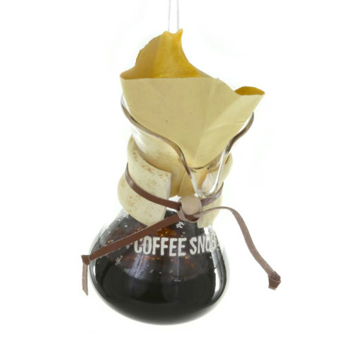 Glass ornament shaped like a pour-over coffee maker with Coffee Snob lettering.
Coffee-themed Christmas ornament with filter, carafe, and dark coffee detail.
Hanging glass coffee ornament measuring 2.25 × 2.25 × 4.5 inches.