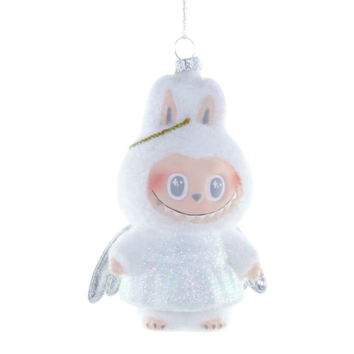 Fuzzy white monster angel glass ornament with silver wings and hanging loop.
Whimsical smiling character ornament with glittery body and soft pastel details.
4.75 inch glass monster angel Christmas ornament on a white background.