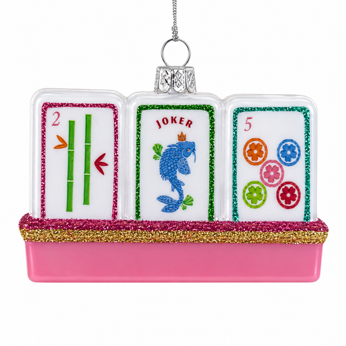Glass mahjong tile ornament with three white tiles on a pink base.
Hanging game-themed ornament with colorful tile designs and glitter trim.
3.5 inch glass Mahjong Tile Christmas ornament on a white background.