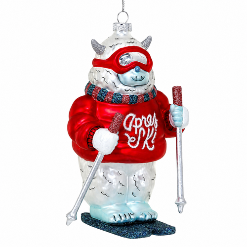 Glass yeti ornament wearing a red apres ski sweater and red goggles.
Ski-themed yeti ornament with skis, poles, scarf, and snowy white fur.
Apres Ski Yeti glass ornament measuring 5 inches.