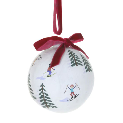 White glass bauble ornament with downhill skiers and evergreen trees.
Ski-themed Christmas ornament with red ribbon bow and hanging loop.
Round glass skier ornament for winter sport holiday decorating.