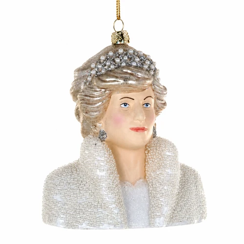 Glass Princess Diana ornament with ivory outfit, pearl-like beading, jeweled headpiece, and silver earrings.
Royal-inspired bust Christmas ornament hanging from a gold cord with glass and bead details.
Princess Diana glass ornament measuring 4 x 2.5 x 4.5 inches.