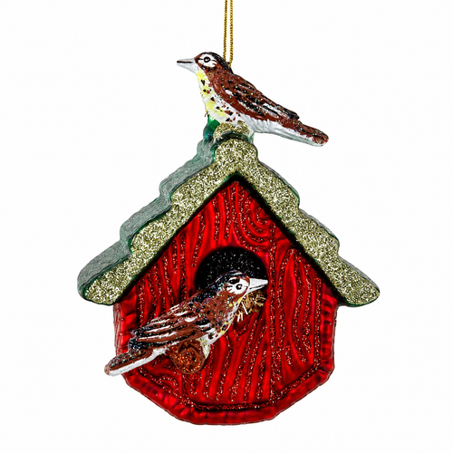 Red glass birdhouse ornament with glittered roof trim and two small birds.
Home Tweet Home Christmas ornament with one bird on top and one bird in the doorway.
Red birdhouse glass ornament measuring 3 x 2.5 x 4 inches.