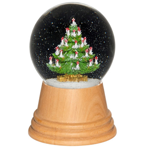Glass snow globe with decorated Christmas tree inside and wooden base.
Real Viennese Christmas tree snow globe with snowy interior.
5-inch Austrian snow globe made with wood and glass.
