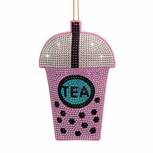 Purple bubble tea Christmas ornament with glittering Bedazzled Collection details.
UV-reactive boba tea ornament made with fabric mâché, plastic, and polyester.
Sparkling purple drink ornament for café trees, garlands, and food-themed décor.
