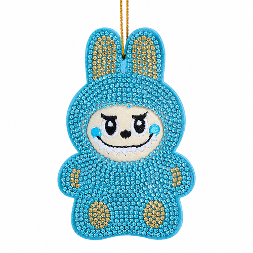 Blue bedazzled monster ornament with sparkling gem-covered body and bunny-style ears.
Whimsical embroidered face with black eyes, smile, and blue cheeks.
3.5-inch Kurt Adler ornament made from fabric mâché, plastic, and polyester.