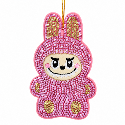 Pink bedazzled monster ornament with sparkling gem-covered body and bunny-style ears.
Whimsical embroidered face with black eyes, smile, and pink cheeks.
3.5-inch Kurt Adler ornament made from fabric mâché, plastic, and polyester.