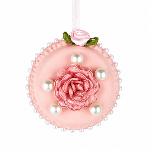 Pink round macaron ornament with nylon tea rose center, faux pearls around and on top, hanging from white ribbon.