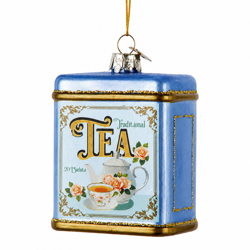 Blue glass tea container Christmas ornament with gold trim and tea label.
Vintage-style ornament featuring teapot artwork, floral details, and Traditional Tea text.
3.5-inch Kurt Adler Noble Gems hanging ornament for tea lover holiday décor.