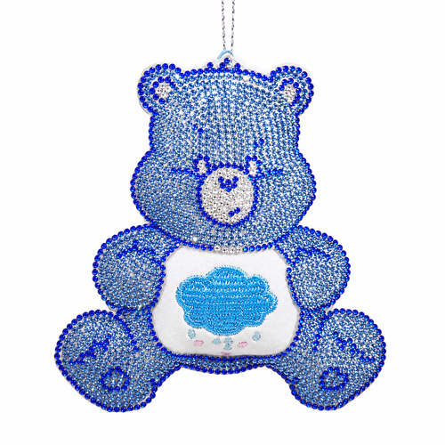 Blue bedazzled Grumpy Bear ornament with sparkling gem details and cloud belly badge.
4-inch hanging character ornament made from Fabmache, plastic, and polyester.
Care Bears-style holiday ornament with blue rhinestone-style accents and attached cord.