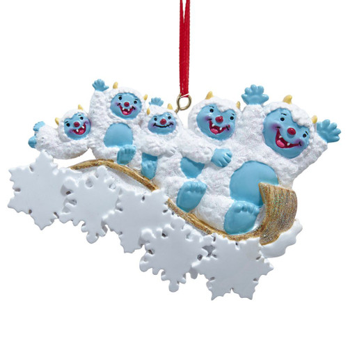 Yeti family of 5 resin ornament with five blue-faced yetis on a glittery sled.
Kurt Adler 5.5-inch personalized ornament with white snowflakes and red hanging ribbon.
Winter family Christmas ornament featuring five smiling yetis and snowy accents.