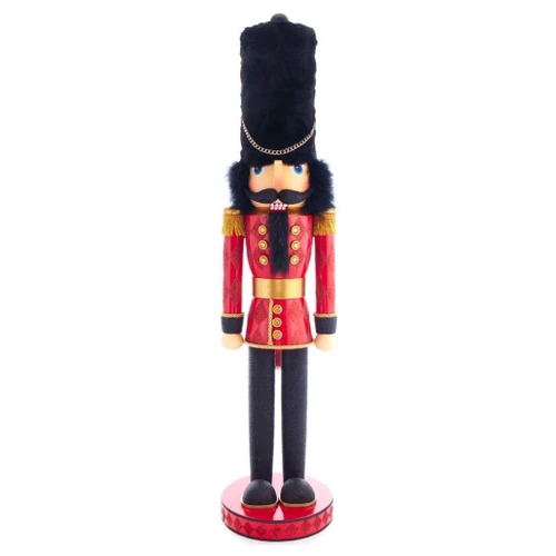 36-inch red royal soldier nutcracker with black tall hat, gold trim, and glitter accents.
Side view of Kurt Adler Hollywood Nutcrackers figure with red jacket, black pants, and round base.
Royal soldier nutcracker styled near a fireplace, Christmas tree, and wrapped gifts.