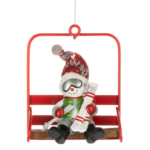 Snowman ornament seated on a red chair lift holding ski gear.
Polyresin and polyester snowman Christmas ornament with goggles and winter hat.
Ski lodge holiday ornament featuring a snowman on a bright red lift chair.