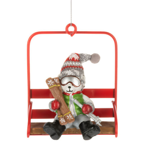 Polar bear ornament seated on a red chair lift holding ski gear.
Polyresin and polyester polar bear Christmas ornament with goggles and knit hat.
Alpine holiday ornament featuring a polar bear on a bright red ski lift chair.