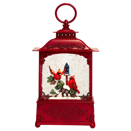 LED water lantern with red cardinals perched on a tree branch.
10.75-inch multicolor lantern with warm white lights and spinning glitter.
Indoor cardinal Christmas lantern made with water, plastic, metal, and copper.