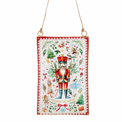 Red metal nutcracker ornament plaque with festive holiday illustrations and decorative border.
Rectangular hanging ornament featuring a nutcracker, Christmas trees, holly, ribbons, and seasonal accents.
Metal Christmas ornament measuring 3.25 x 5.25 inches with attached hanging cord.