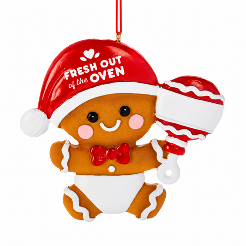 Baby gingerbread ornament wearing a red Santa hat and holding a red-and-white rattle.
Resin Christmas ornament with “Fresh Out of the Oven” lettering on the hat.
Smiling gingerbread baby ornament measuring 4 x 3 7/8 inches with red and white details.