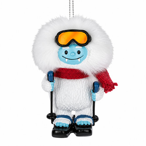 Yeti ornament with red scarf, orange goggles, ski poles, and snowshoes.
Resin Christmas ornament featuring white furry-look yeti and blue face.
Winter sports ornament measuring 3.25 inches with hanging cord.