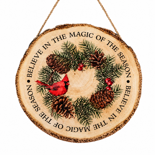 Wood slice ornament with cardinal, pine branches, pinecones, and berries.
Rustic MDF and jute Christmas ornament with “Believe in the magic of the season” text.
Round woodland ornament measuring 1.5 x 9 inches with jute hanger.