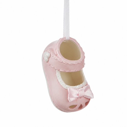 Pink porcelain baby shoe ornament hanging from a white ribbon.
Girl baby shoe ornament with white trim and satin-style bow detail.
Small 2.5 x 1.25 inch porcelain baby shoe ornament for holiday décor.