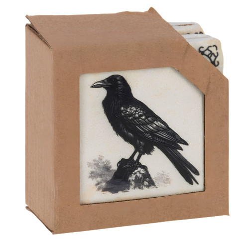 Vintage Halloween coaster set in kraft-style box with black raven illustration visible.
Set of 4 square coasters with black-and-white spooky artwork.
Resin and cork Halloween coaster set measuring 4 x 4 x 1.75 inches.