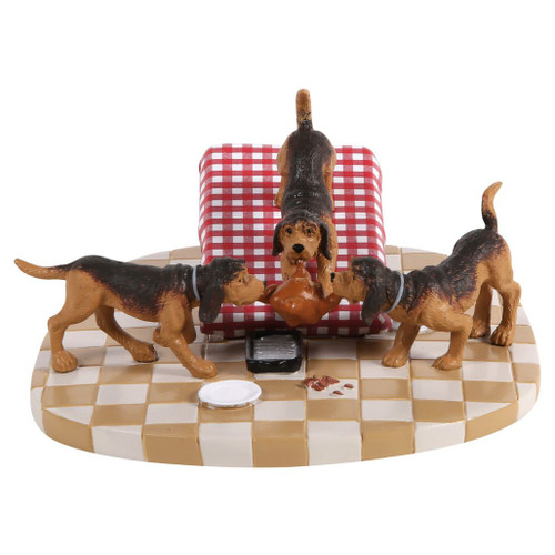 Department 56 A Christmas Story Village accessory with three hounds pulling a turkey beside a tipped checkered table.
Turkey For The Hounds figurine showing dogs, fallen turkey, scattered plates, and tan-and-white checkered floor base.
Rear view of A Christmas Story Village hounds accessory with red gingham table and polyresin dog figures.