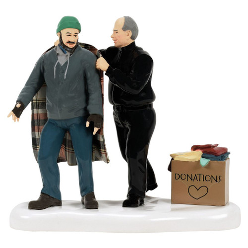 Department 56 Snow Village accessory showing one figure wrapping another in a plaid blanket beside a donations box.
50th Warmed In His Grace figurine with two people on a snowy base and folded clothing in a donation box.
Rear view of Snow Village accessory showing plaid blanket detail and donation box on white snow base.