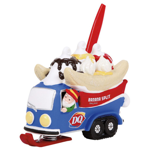 Department 56 Splits In A Blitz! Dairy Queen banana split delivery vehicle accessory.
Blue DQ village vehicle with oversized banana split, red spoon, whipped topping, and driver.
North Pole Village porcelain, plastic, and zinc alloy accessory measuring 4.92 inches high.