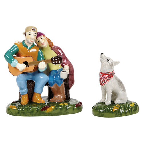 Department 56 Fireside Serenade ceramic accessory set with seated couple, guitar, mug, and howling dog.
Snow Village Halloween figurines on glossy green bases with fall leaf details and red dog bandana.
Set of 2 ceramic Halloween village accessories featuring campers serenading beside their dog.