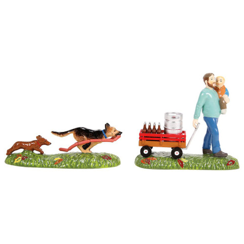 Department 56 Headin' To The Fest set with dad holding a child beside a wagon loaded with bottles and a keg.
Snow Village Halloween accessory showing two dogs running with a bratwurst on a grassy fall base.
Set of 2 Halloween village accessories with glossy figures, wagon detail, and autumn leaves.