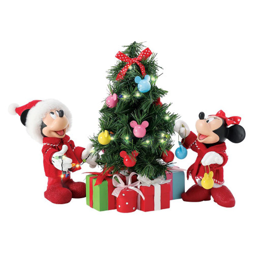 Department 56 Possible Dreams Mickey Mouse Decorations figurine with Mickey, Minnie, and a lit Christmas tree.
Officially licensed Disney 3-piece collectible with colorful ornaments, wrapped gifts, and LED tree lights.
Possible Dreams Mickey Mouse Decorations figurine measuring 9 inches high with PVC, LED, polyester, Clothtique, and battery box.