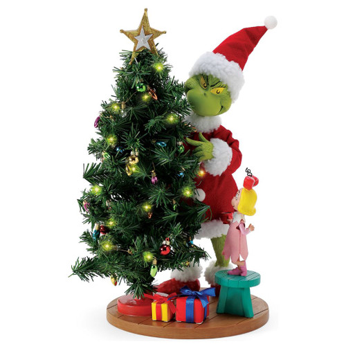 Department 56 Possible Dreams Fixing the Light Grinch figurine with Grinch, Cindy-Lou, and a lit Christmas tree.
Grinch collectible in Santa outfit beside LED tree with colorful ornaments, gifts, star topper, and Cindy-Lou on stool.
Possible Dreams Fixing the Light Grinch figurine measuring 14.5 inches high with PVC, LED, polyester, Clothtique, and battery box.