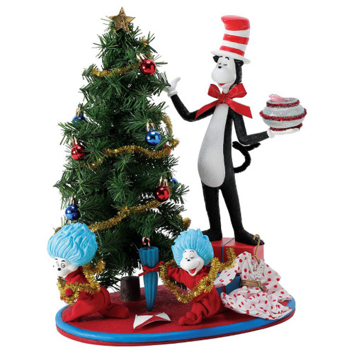 Department 56 Possible Dreams Thing 1 and Thing 2 Decorate Tree figurine with Cat in the Hat and Christmas tree.
Cat in the Hat collectible with Thing 1 and Thing 2, garland, ornaments, gift boxes, and fishbowl detail.
Possible Dreams Thing 1 and Thing 2 Decorate Tree figurine measuring 14.75 inches high with PVC, polyester, resin, and Clothtique materials.