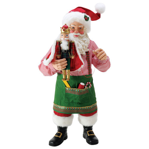 Possible Dreams Nutcracker King Santa figurine featuring Santa in a workshop apron holding a royal nutcracker with Clothtique fabric details.
Oversized 24.5-inch Department 56 Santa collectible with hand-painted details, festive apron, and handcrafted nutcracker.
Front view of Nutcracker King Santa collectible with striped shirt, green apron, Clothtique clothing, and decorative holiday accents.