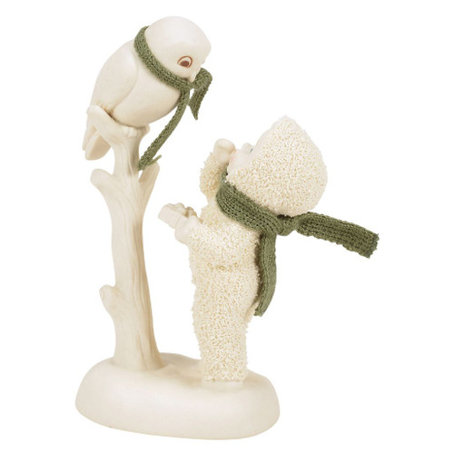 Snowbabies Guess Whooo This Is For? figurine featuring a Snowbaby offering a gift to a perched owl.
Hand-crafted porcelain figurine with knitted polyester scarves and hand-painted details.
Winter woodland Snowbabies collectible with an owl perched on a snowy tree branch.