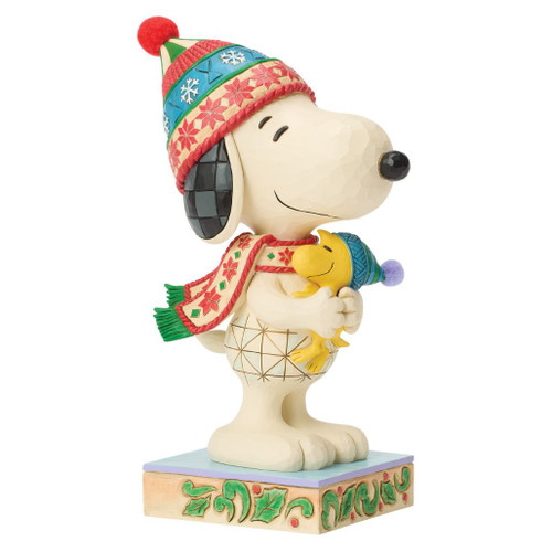 Jim Shore A Warm Embrace figurine featuring Snoopy hugging Woodstock while wearing festive winter hats and scarves.
Hand-painted stone resin Peanuts collectible with colorful folk-art patterns and holiday details.
Large Peanuts Christmas figurine celebrating friendship, warmth, and the holiday season.