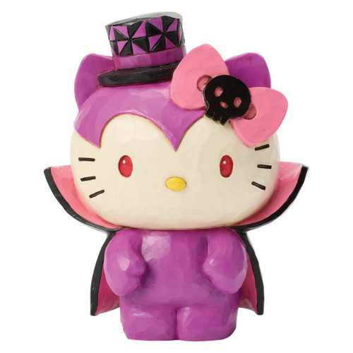 Jim Shore Hello Kitty Vampire Mini figurine wearing a purple vampire outfit with a cape and top hat.
Hand-painted stone resin Hello Kitty Halloween collectible featuring red eyes and a Halloween-themed bow.
Mini Sanrio figurine with Jim Shore folk-art detailing and vampire-inspired costume.