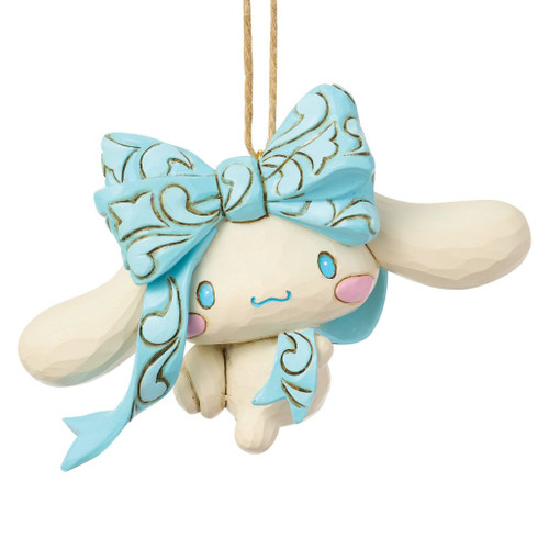 Cinnamoroll ornament by Jim Shore featuring an oversized blue folk art bow and floppy ears.

Hand-painted stone resin Sanrio Christmas ornament with pastel blue and cream finishes.

3.5-inch hanging holiday ornament showcasing Jim Shore's signature folk art styling.