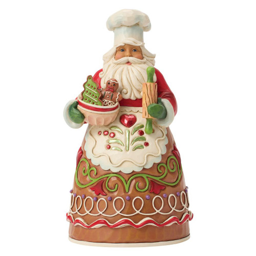 Jim Shore Baking Holiday Magic Chef Santa figurine wearing a chef's hat and apron while holding a rolling pin and bowl of gingerbread cookies.
Hand-painted Heartwood Creek gingerbread-themed Santa in stone resin featuring folk art details and festive baking accents.
Decorative Christmas Chef Santa collectible with gingerbread cookies, rolling pin, and holiday-inspired apron design.