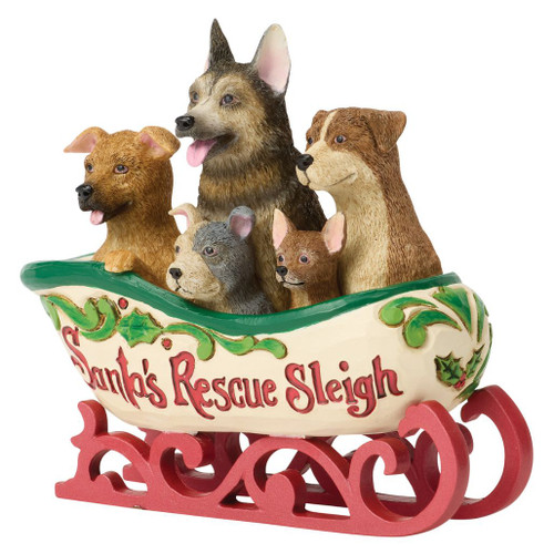 Jim Shore Santa's Rescue Sleigh figurine filled with five adorable rescue puppies and festive holly accents.
Hand-painted Heartwood Creek sleigh featuring rescue dogs, red metal-look runners, and folk-art styling.
Stone resin Christmas collectible with puppies riding in Santa's Rescue Sleigh and decorative holiday detailing.