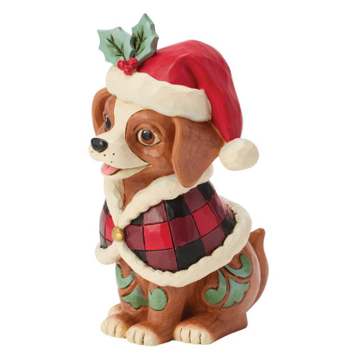 Jim Shore Highland Glen dog figurine wearing a buffalo plaid cape and Santa hat with holly accents.
Hand-painted stone resin dog figurine featuring folk-art rosemaling and quilt-inspired detailing.
Heartwood Creek Highland Glen "Highland Helper" dog collectible for Christmas decorating.