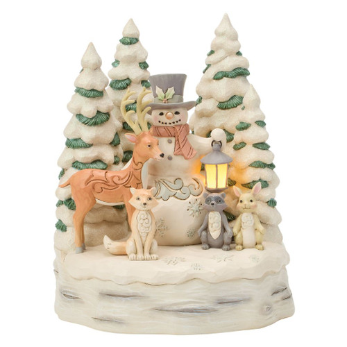 Jim Shore Woodland Snowman with Forest figurine featuring a snowman surrounded by a deer, fox, raccoon, rabbit, and snow-covered pine trees.
Hand-painted stone resin LED Christmas figurine with illuminated lantern and White Woodland styling.
Woodland holiday centerpiece with glowing lantern, evergreen trees, and intricate folk-art details.
