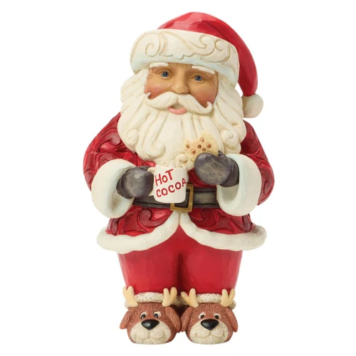 Jim Shore Chocolatey Goodness Santa figurine holding a mug of hot cocoa and a cookie with festive holiday details.
Hand-painted Heartwood Creek stone resin Santa wearing reindeer slippers and a red folk-art patterned coat.
5.12-inch collectible Christmas Santa figurine with cocoa mug, cookie, and cozy winter styling.