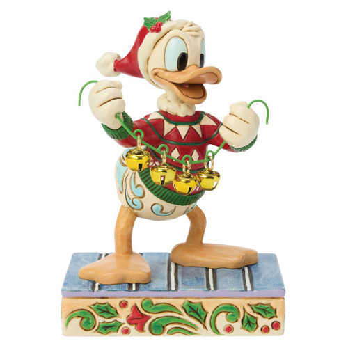Alt 1: Jim Shore Disney Traditions Holiday Jingle figurine featuring Donald Duck wearing a Santa hat and holding real jingle bells.

Alt 2: Hand-painted stone resin Donald Duck Christmas collectible with festive sweater and golden jingle bells.

Alt 3: Disney Traditions Holiday Jingle figurine of Donald Duck with holiday bells and Jim Shore folk-art detailing.