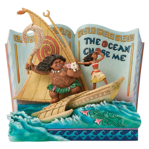 Alt Text 1:
Jim Shore Disney Traditions "The Ocean Chose Me" StoryBook figurine featuring Moana, Maui, and Pua sailing through sculpted ocean waves.

Alt Text 2:
Hand-painted stone resin Disney Traditions StoryBook collectible with an open book backdrop reading "The Ocean Chose Me."

Alt Text 3:
7-inch Jim Shore Moana StoryBook figurine with intricate folk-art detailing, canoe, sail, and ocean wave base.