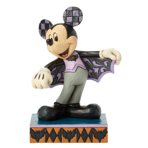 Jim Shore Mickey Mouse wearing a purple bat costume with decorative bat-wing cape on a Halloween-themed base.
Hand-painted Disney Traditions Mickey Bat Costume figurine crafted from stone resin with folk-art detailing.
Multiple views of Mickey Mouse Halloween figurine featuring bat motifs and a festive display base.