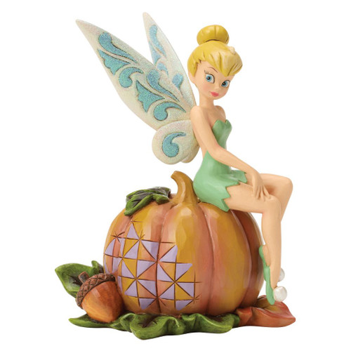 Jim Shore Tinker Bell figurine sitting on a carved folk-art pumpkin with sparkling blue-and-white wings.
Disney Traditions Tinker Bell Halloween collectible featuring autumn leaves, an acorn, and hand-painted stone resin details.
Official Disney Tinker Bell Pumpkin Patch Pixie figurine with glittered wings and seasonal harvest accents.