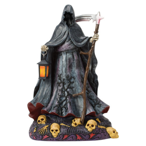 Jim Shore LED Grim Reaper figurine holding a glowing lantern and scythe above a base decorated with skulls and bones.
Hand-painted Heartwood Creek stone resin Grim Reaper with red LED lighting beneath the cloak and detailed Halloween accents.
Halloween collectible featuring a hooded Grim Reaper, illuminated lantern, skeletal details, and bone-strewn base.